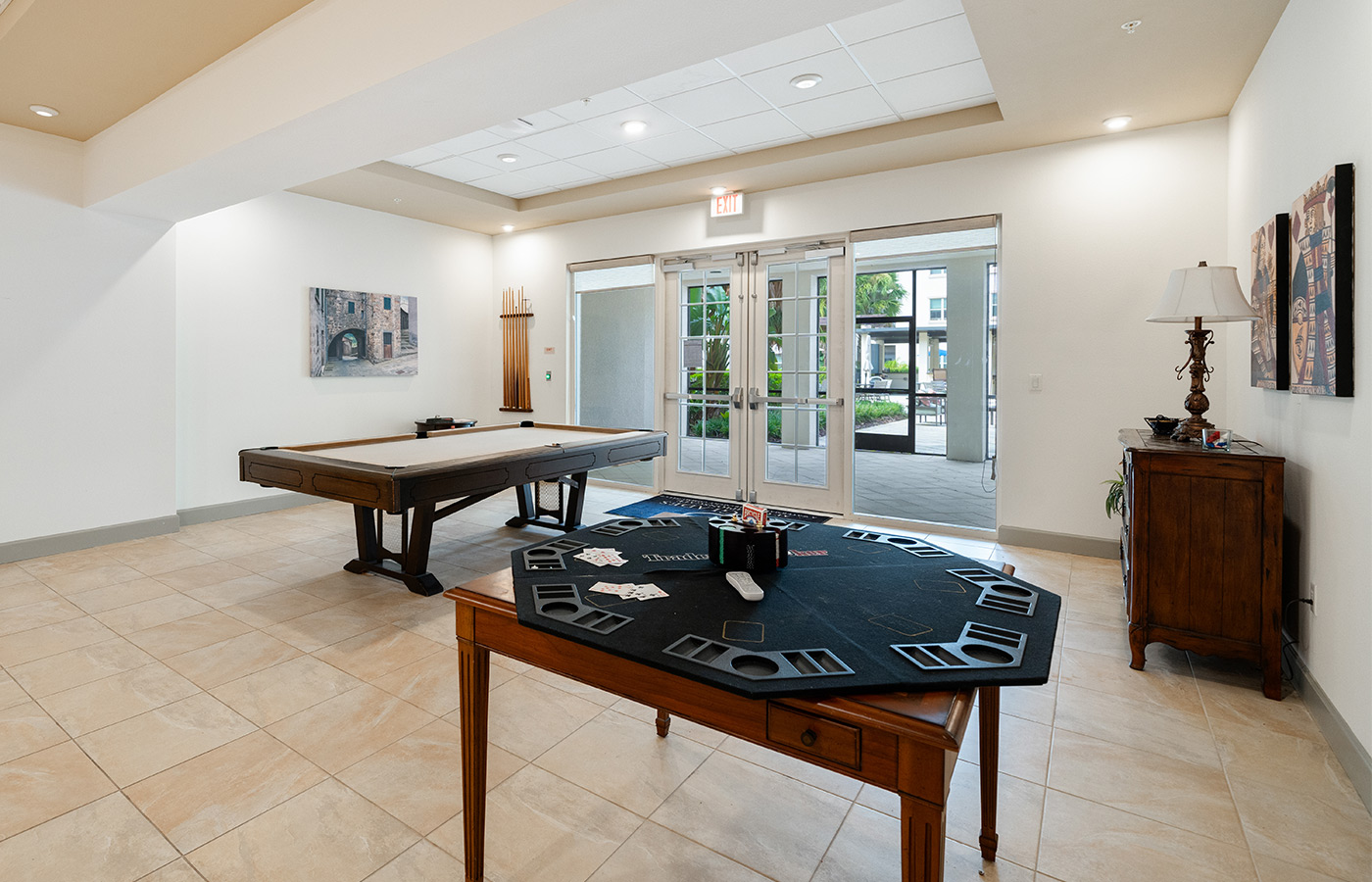 A game room with billiards and a card table.