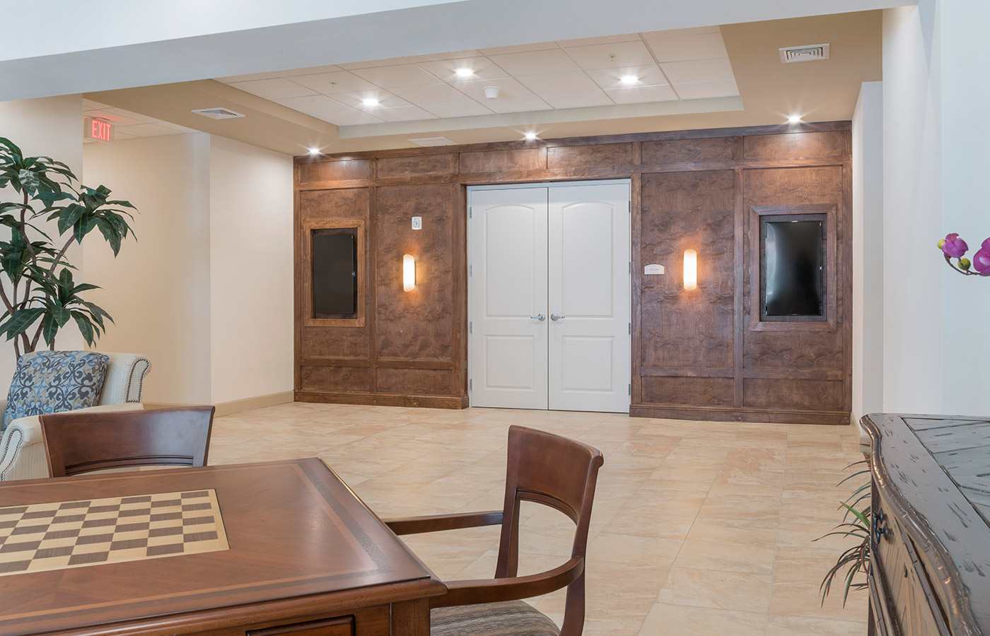 A game room with a chess table.