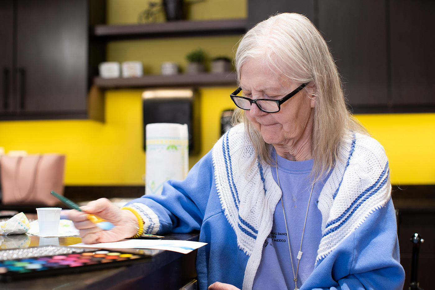 Resident enjoying watercolor painting.