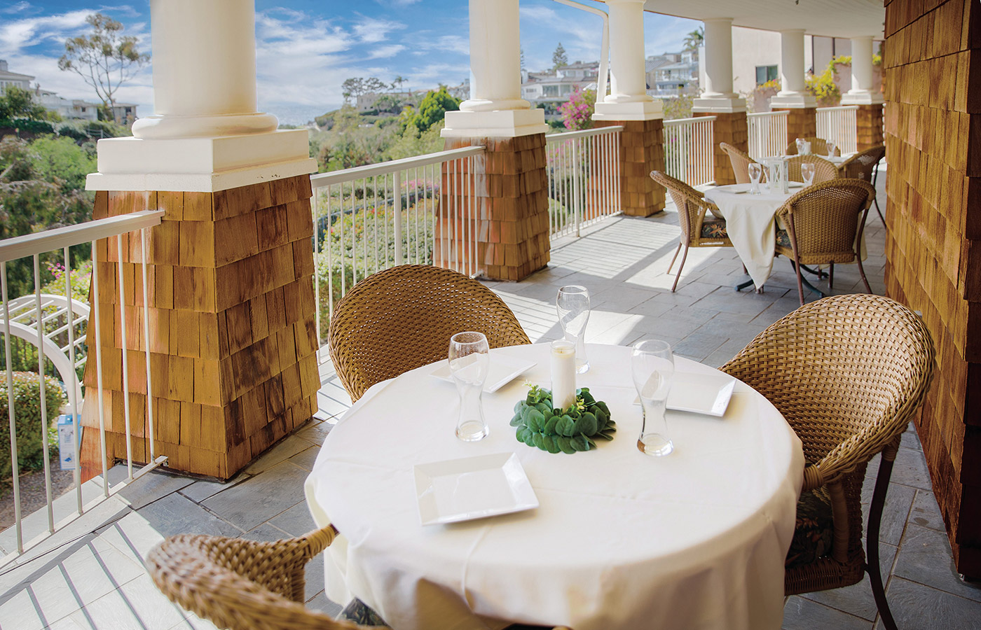 Outside dining area on the balcony at Crown Cove.