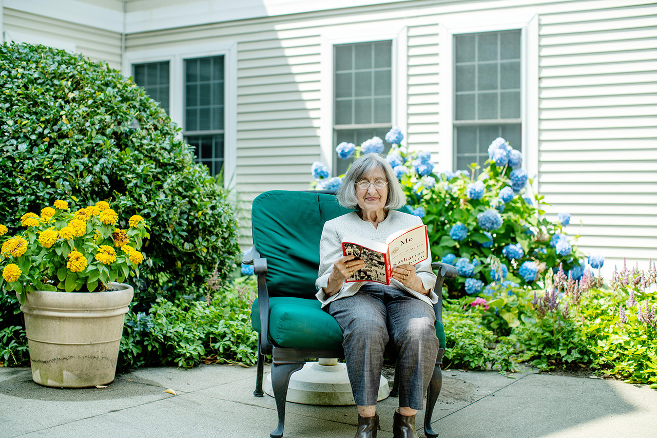 A resident sitting outside in the courtyard. 