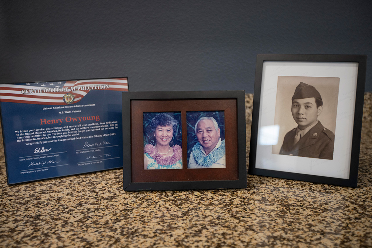 Pictures in frames on top of a dresser.