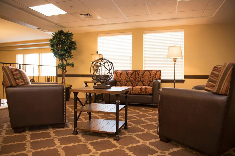 A sitting area with two sofas and a coffee table.