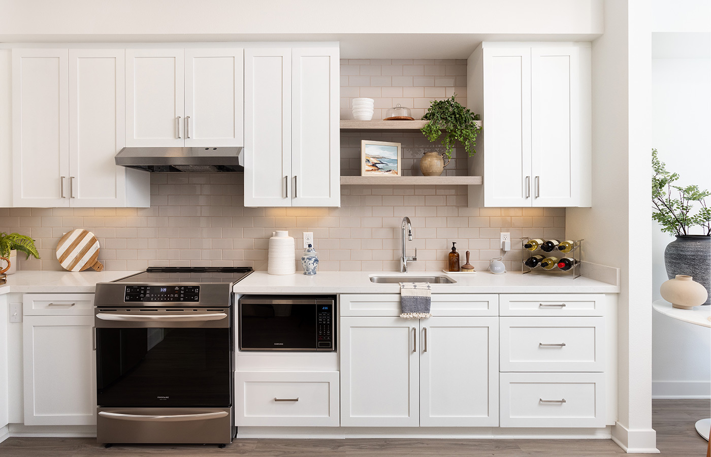 A fully furnished model apartment kitchen.