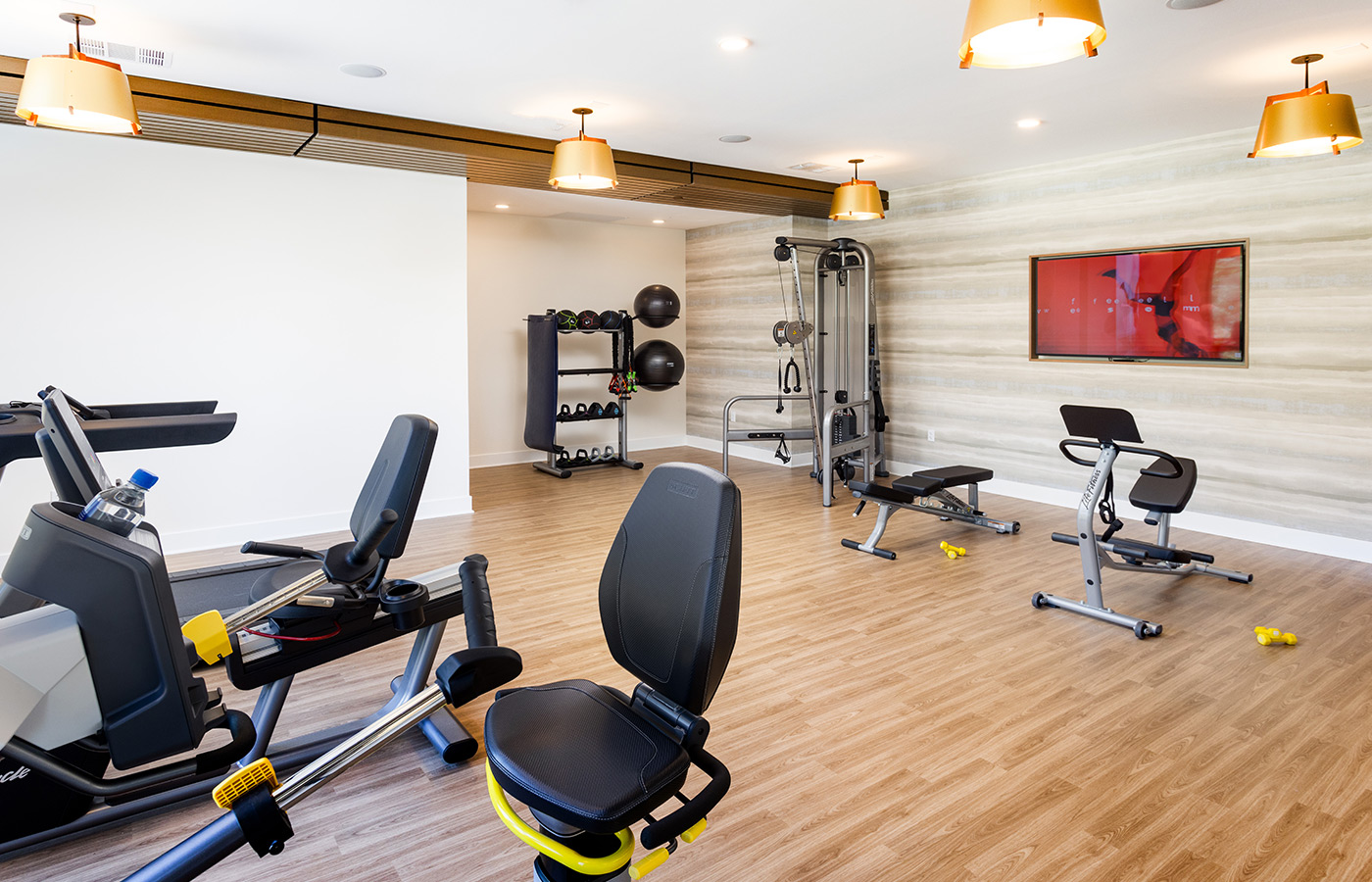 A fitness center with exercise equipment.