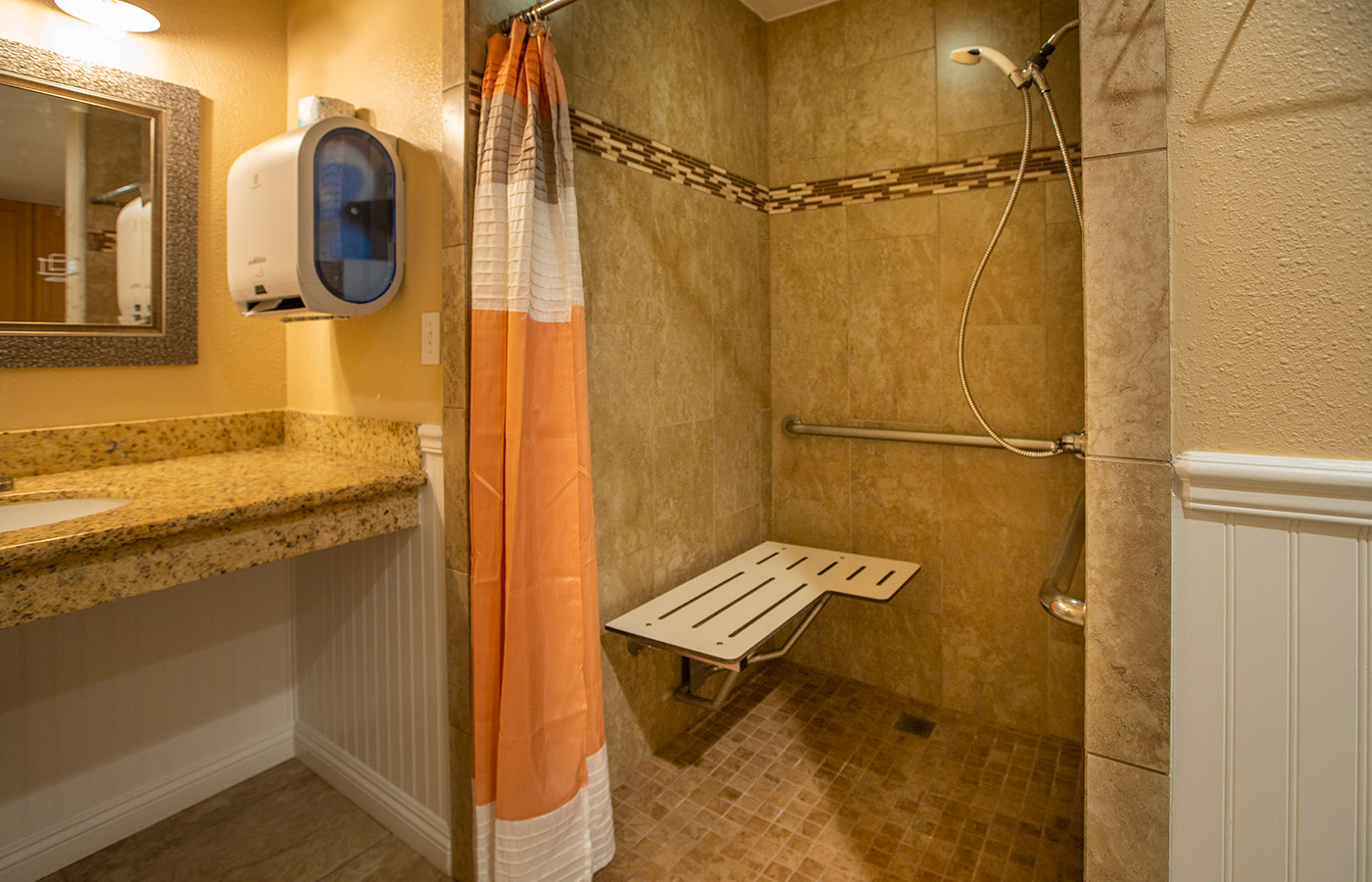 Shower Room with a bench to sit.