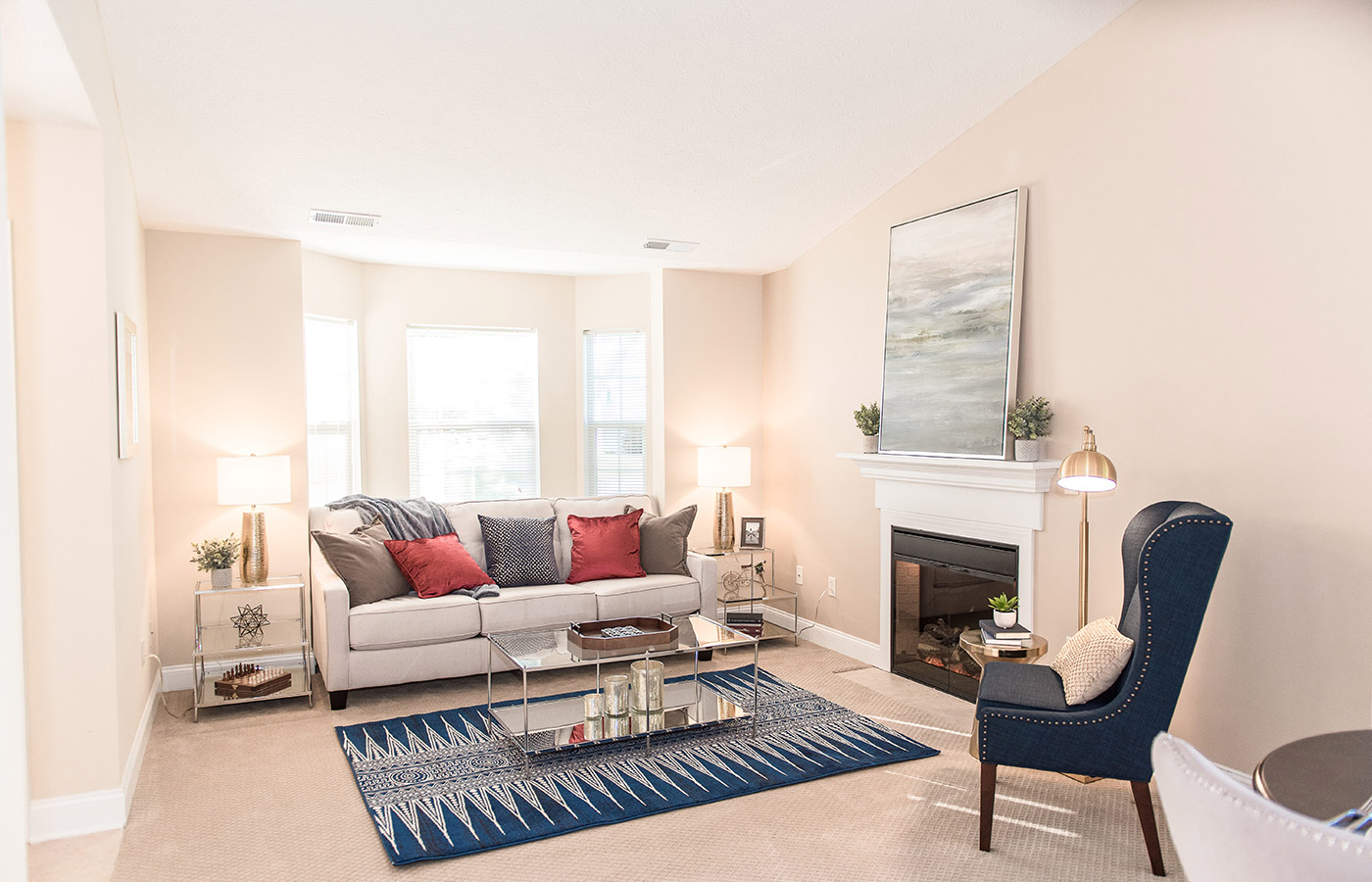 Furnished living room space with sofa, table, and seating area.