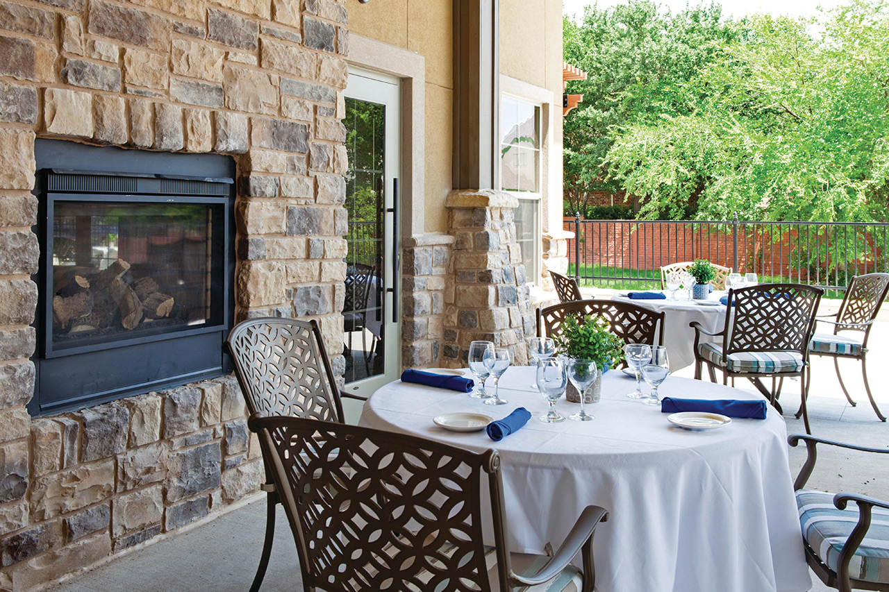 Seating area for dining by a fireplace.