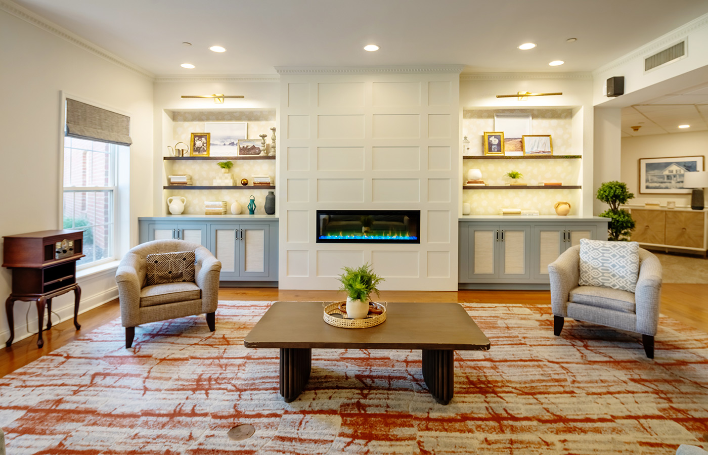 A community living room with a fireplace.