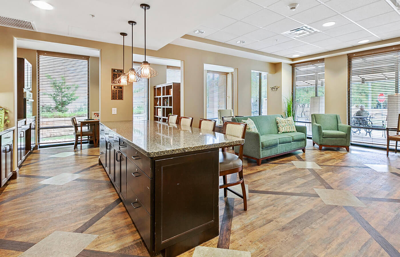 Seating area with counter and windows.