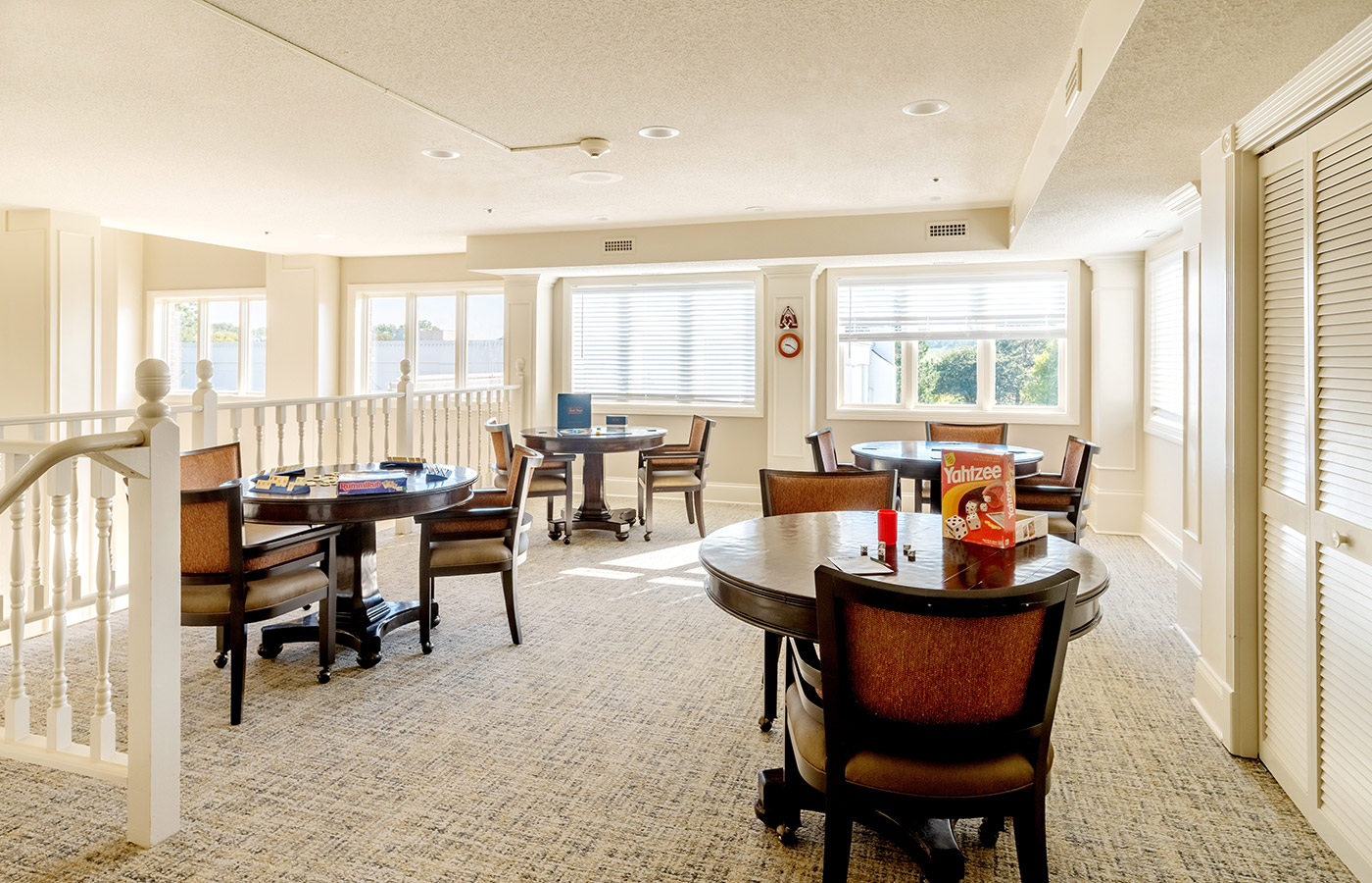 A common area with games on the tables at The Fountains at Crystal Lake.