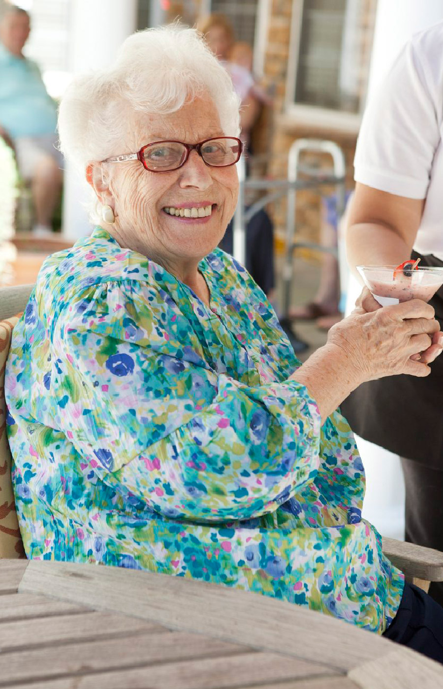 A happy resident sitting.