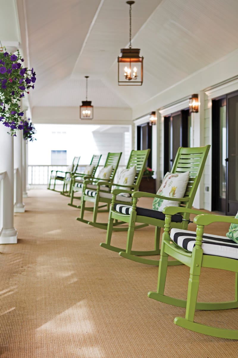 The Fountains at Millbrook porch with row of rocking chairs.