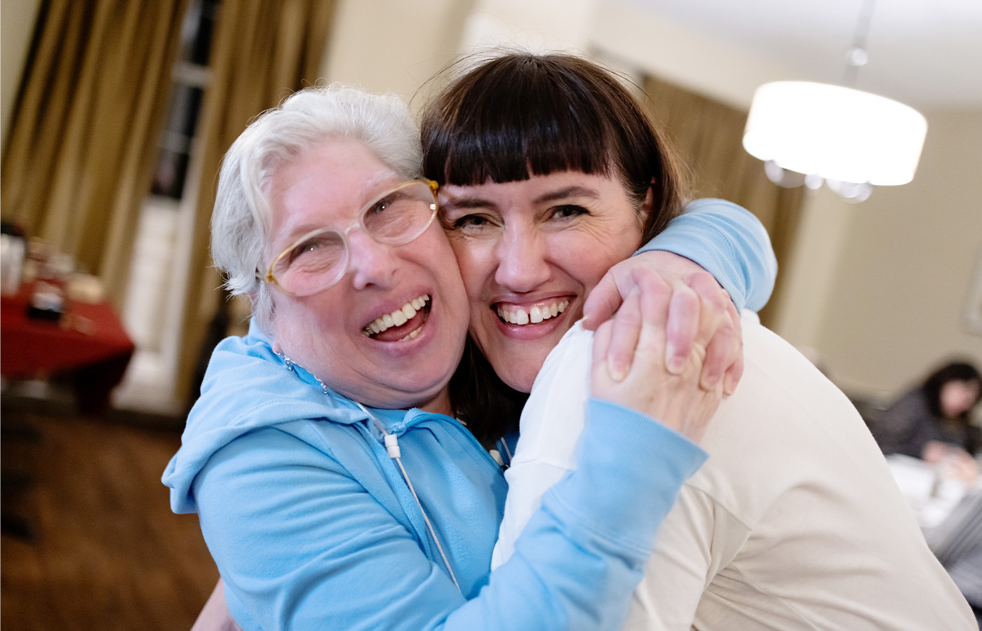 Two people hugging.