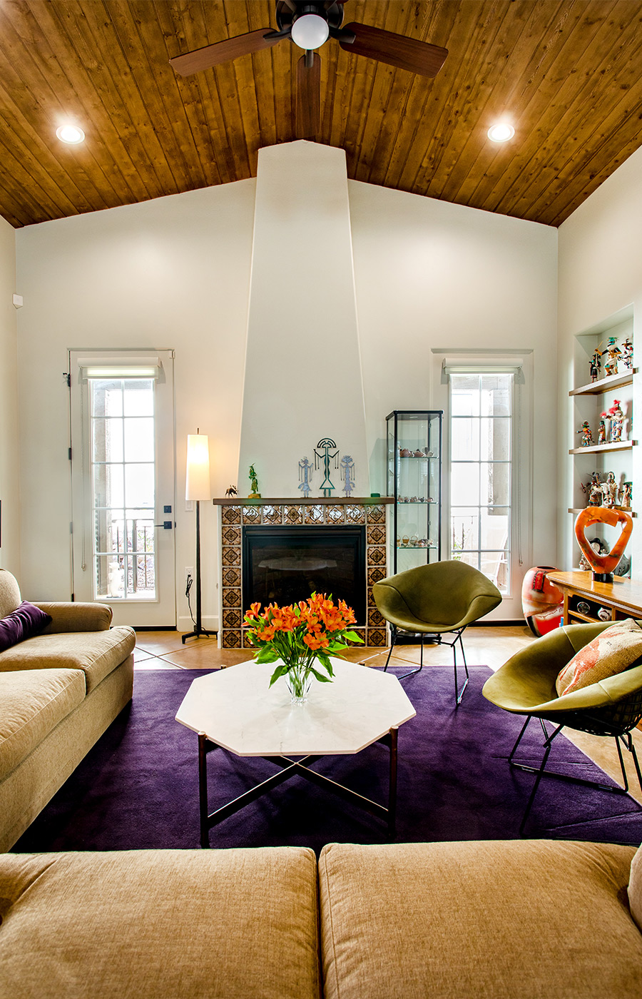 Seating area with sofas, chairs, and tables.