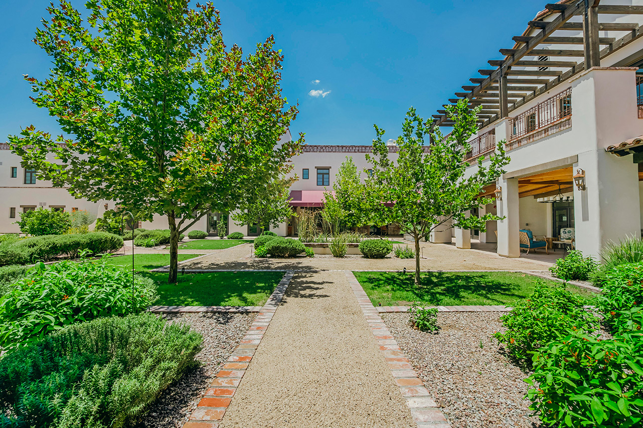 The Hacienda at the River exterior building and courtyard. 