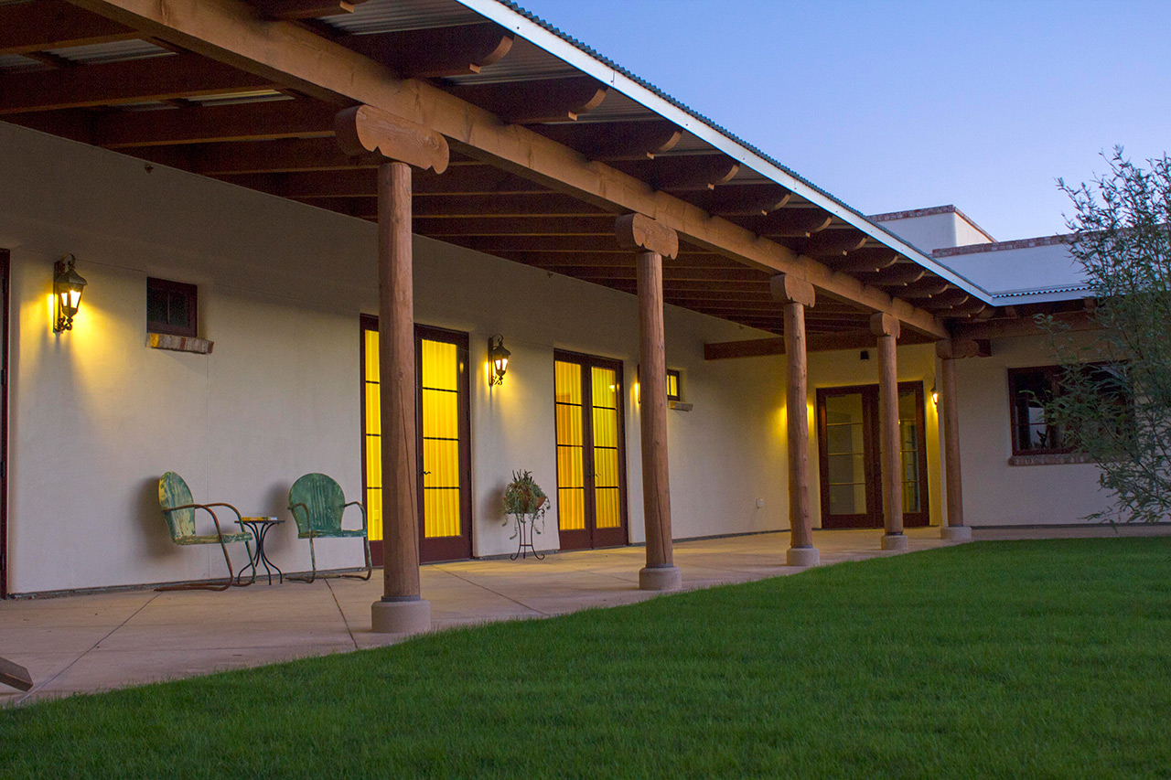 The Hacienda at the River exterior building and courtyard. 
