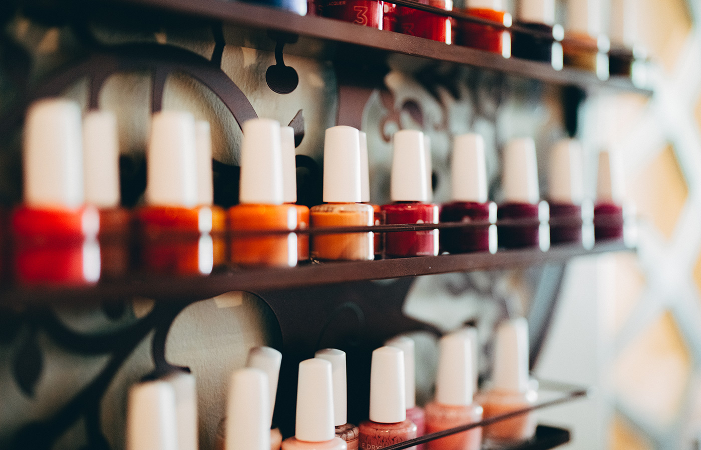 Row of nail polish bottles.