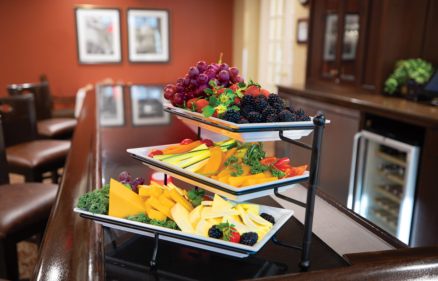 Assorted cheeses and fruit at the bar.