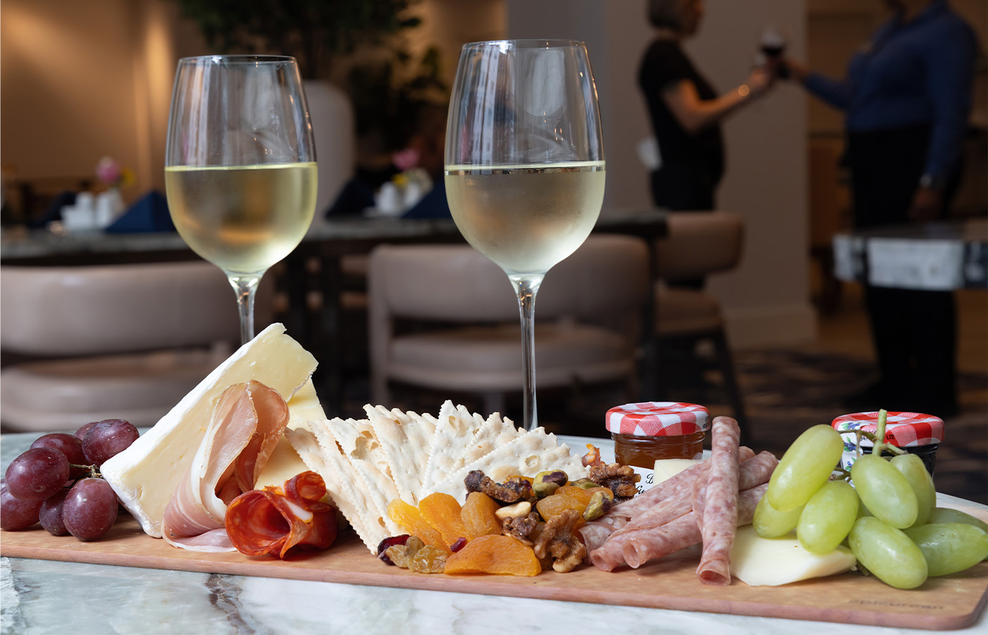 A charcuterie board with wine.