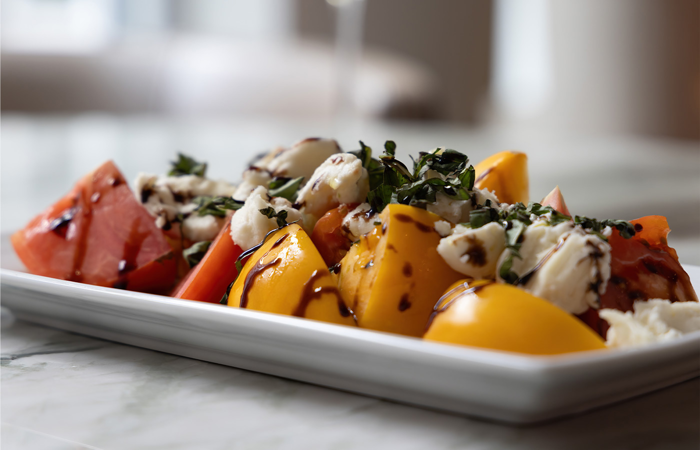 A caprese salad on a plate.