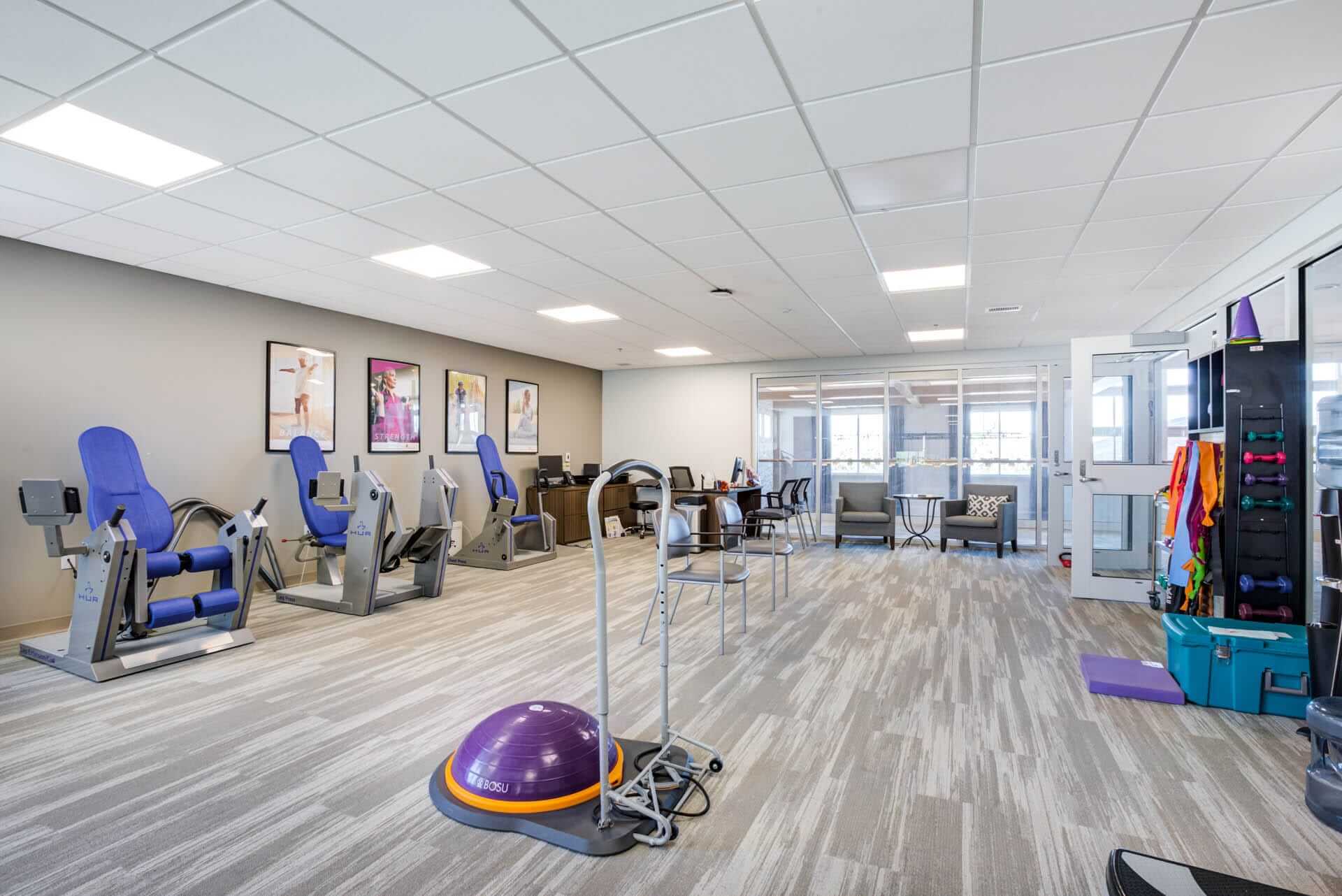 Fitness room with machines.