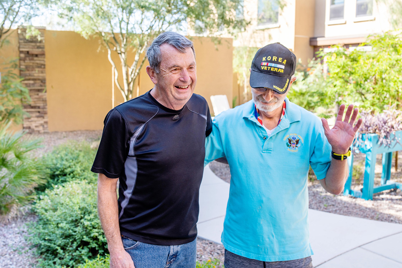 Two residents are outside at The Watermark at Oro Valley.