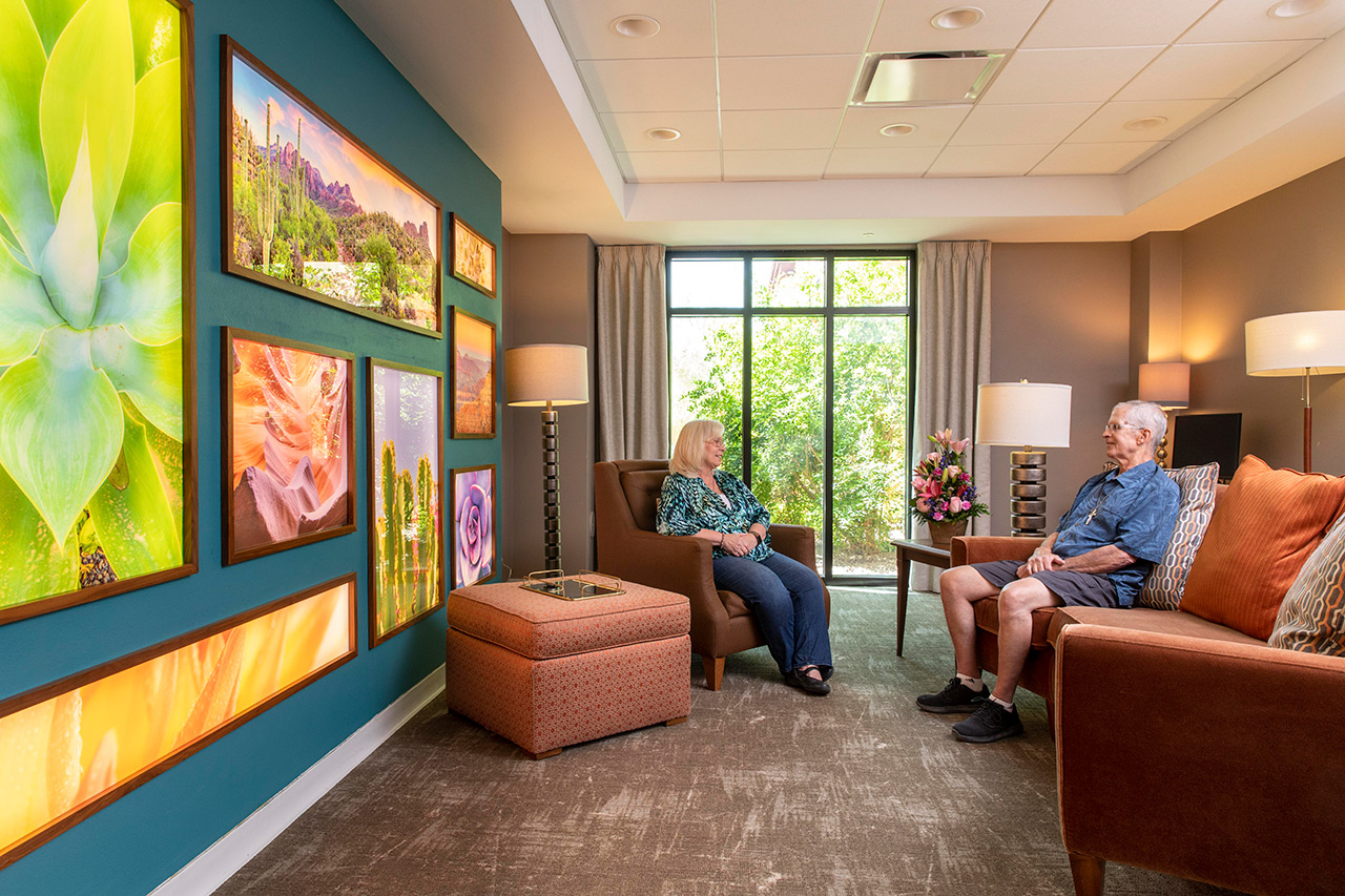 Two residents are sitting in The Watermark at Oro Valley.