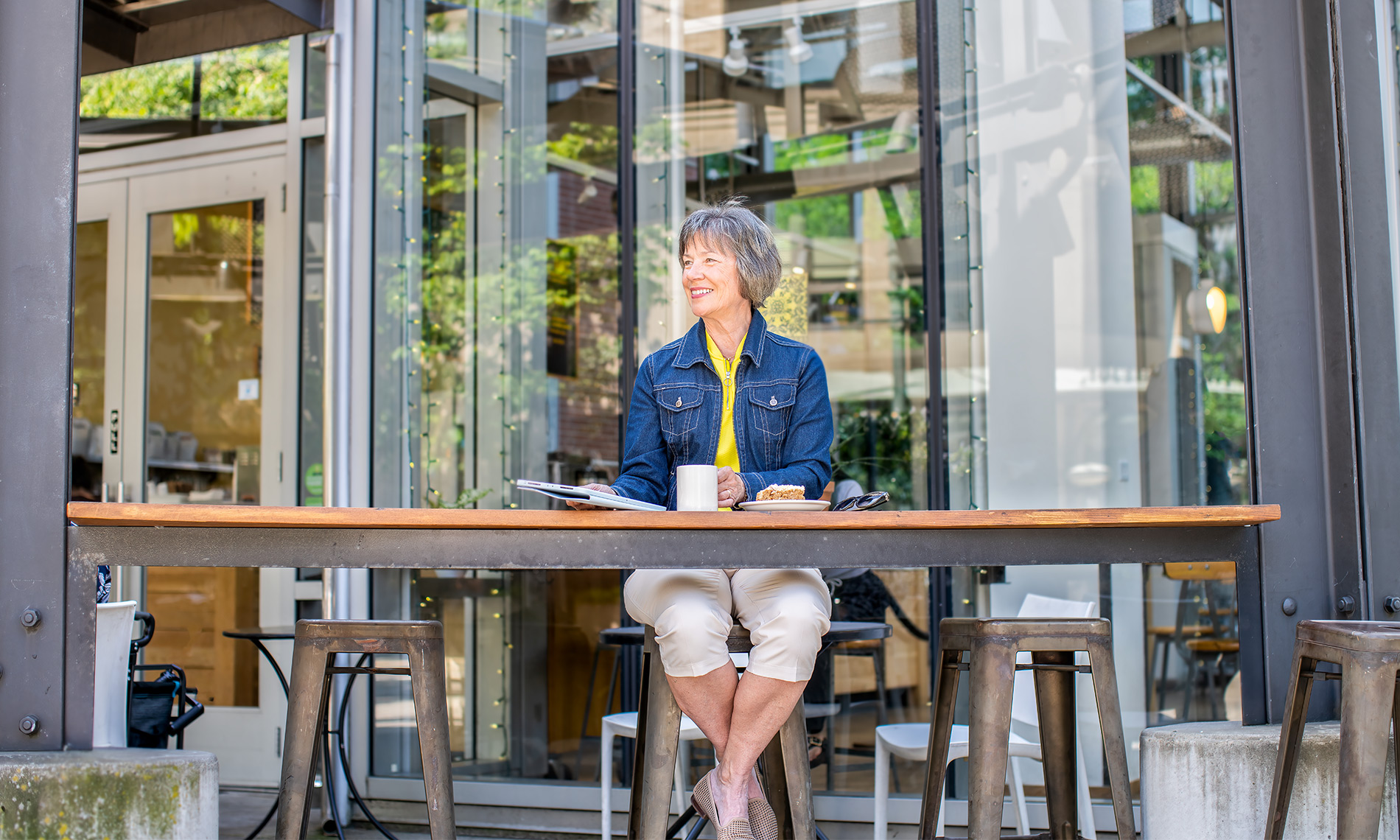 A person sitting having coffee.