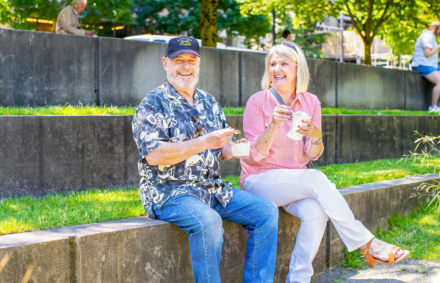 People sitting outside having ice cream.