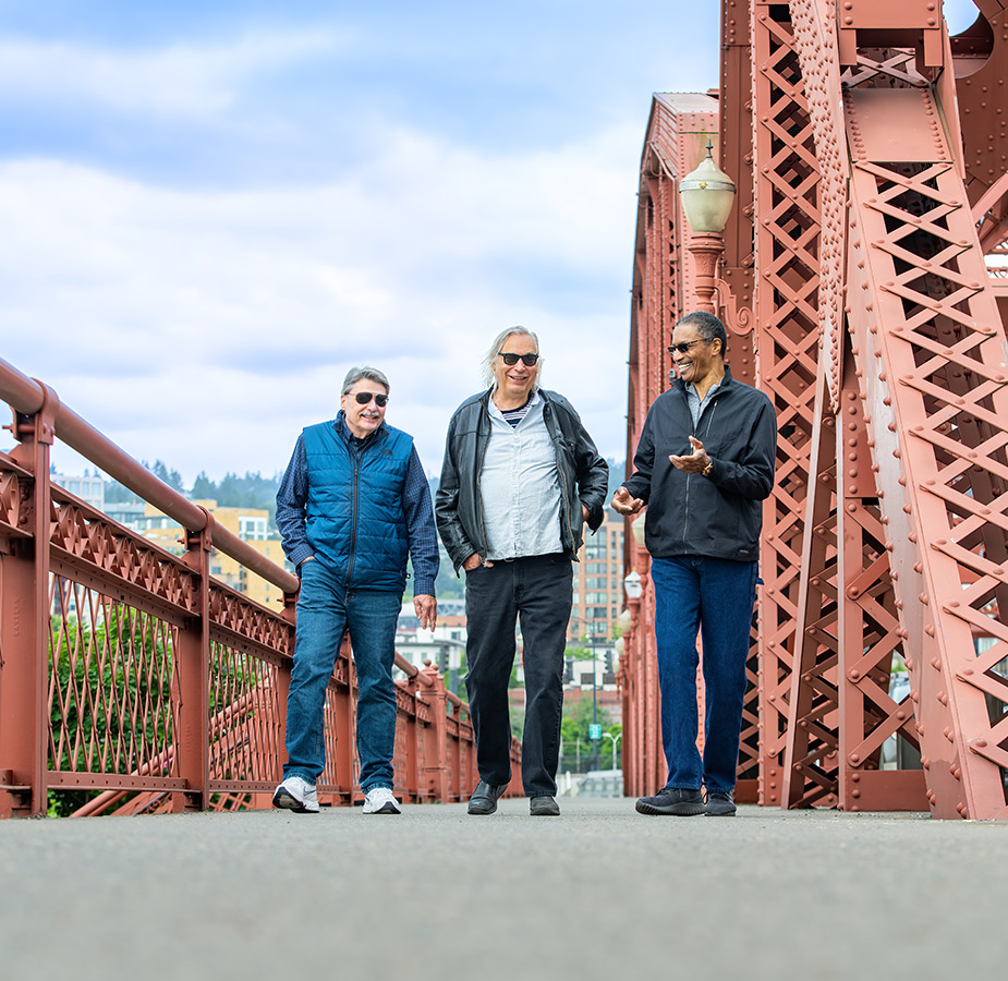 People walking on a bridge.