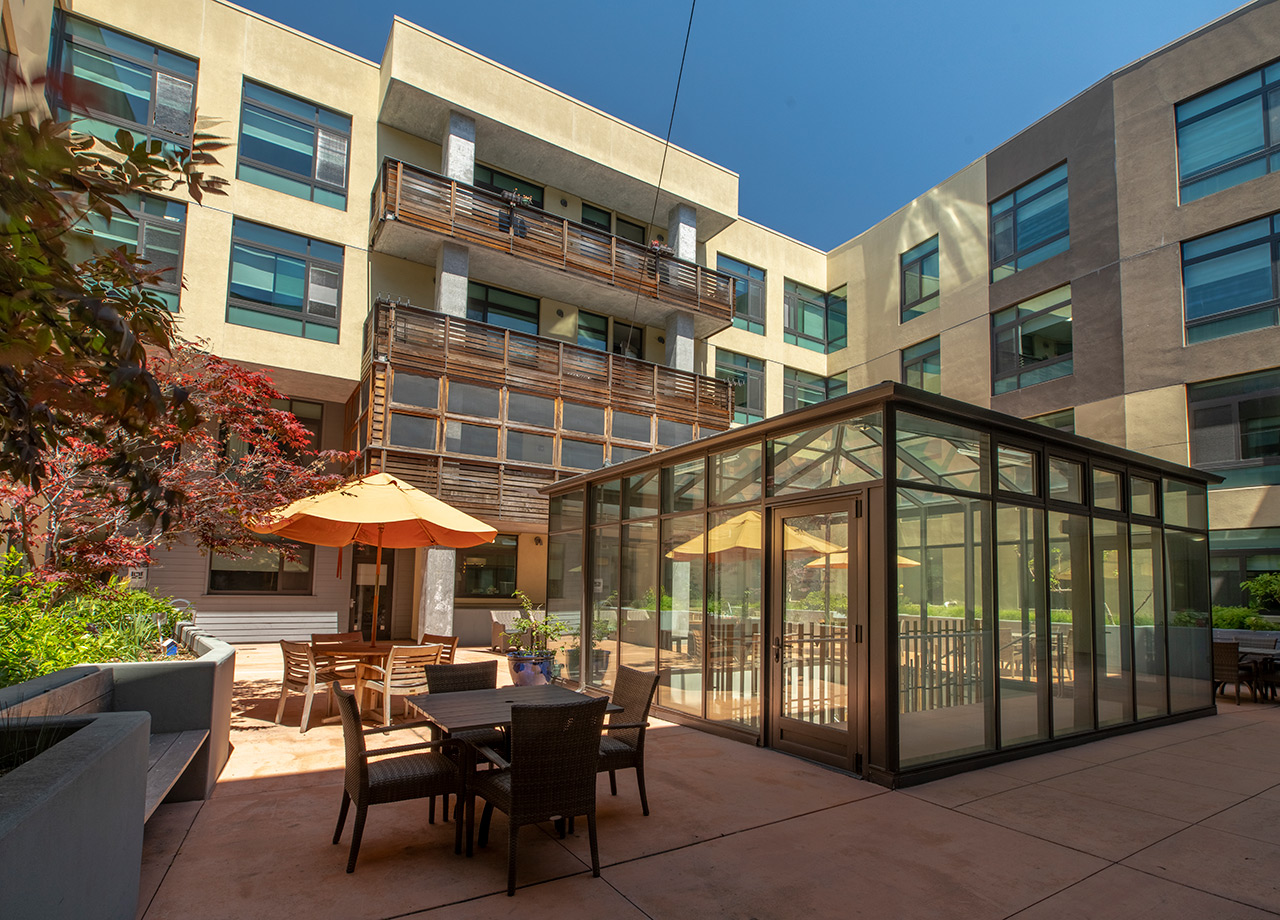 The Watermark By The Bay patio with seating area.