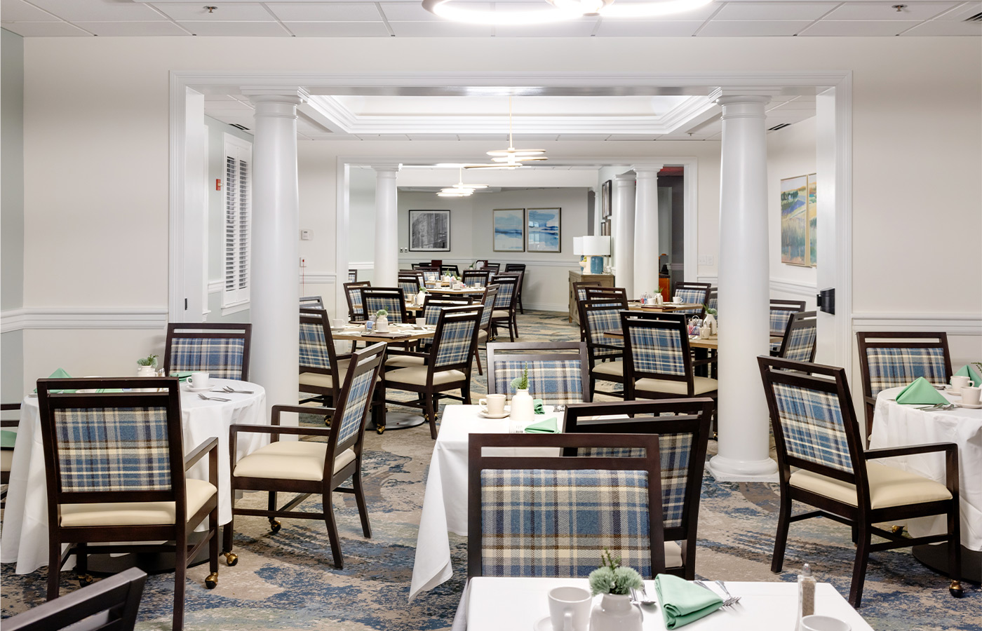 a dining room with many tables.