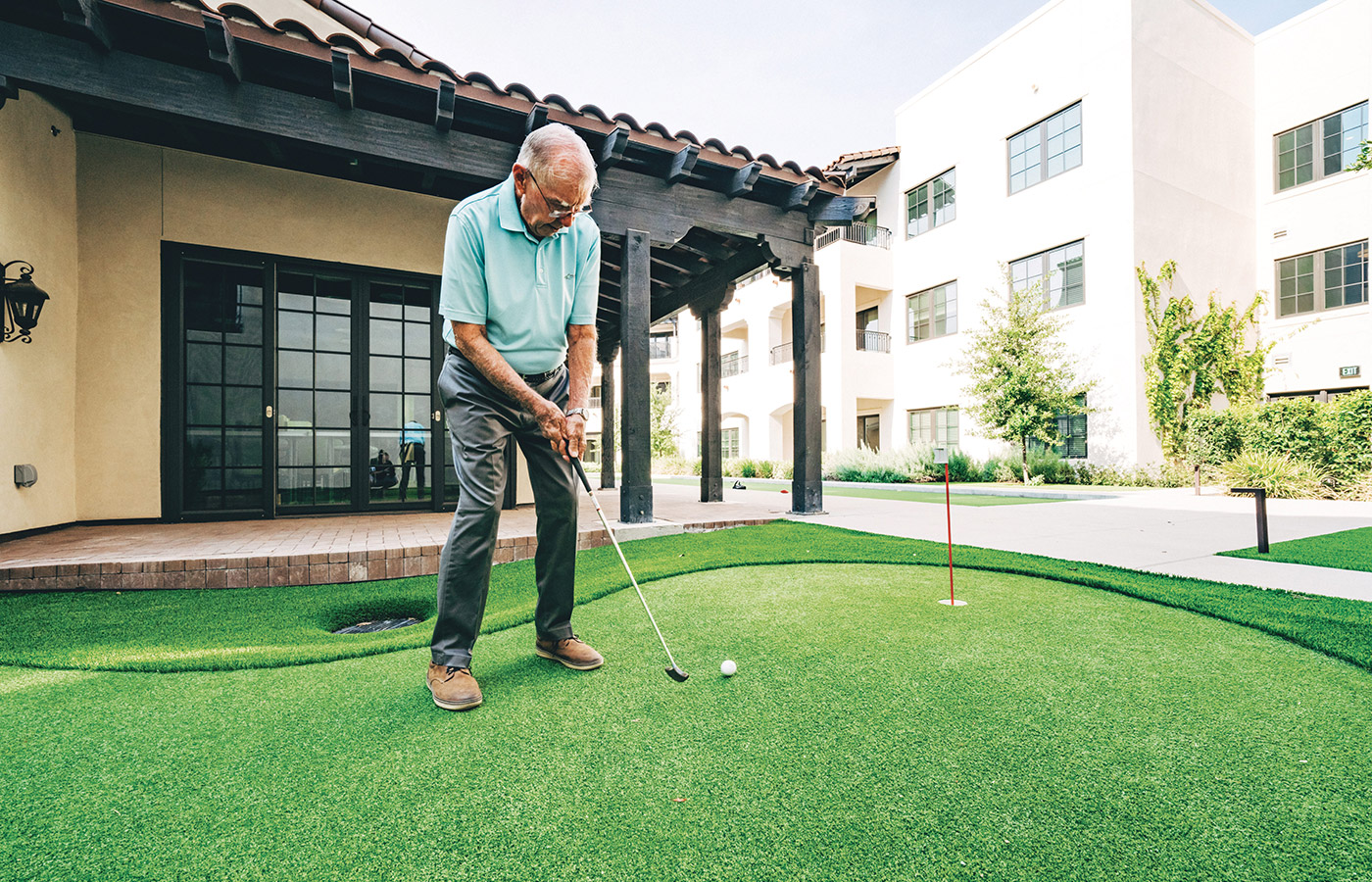 A resident playing golf.