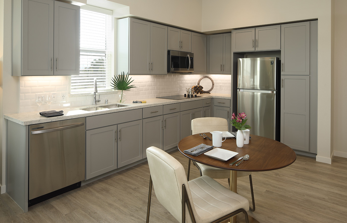 A modern kitchen and dining area.