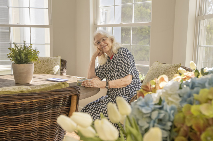 A resident is sitting at a table.