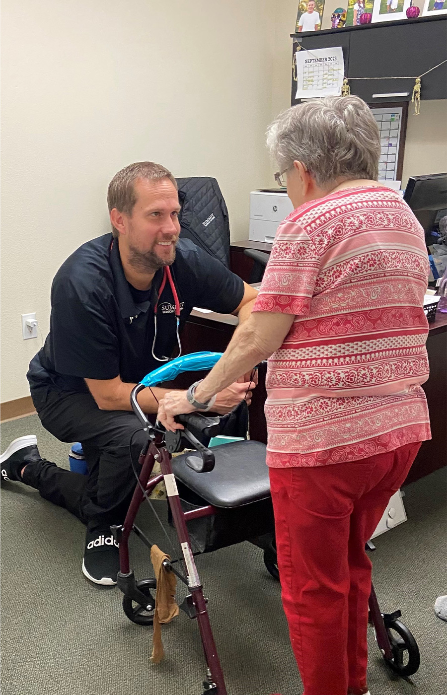 A person helping a resident.