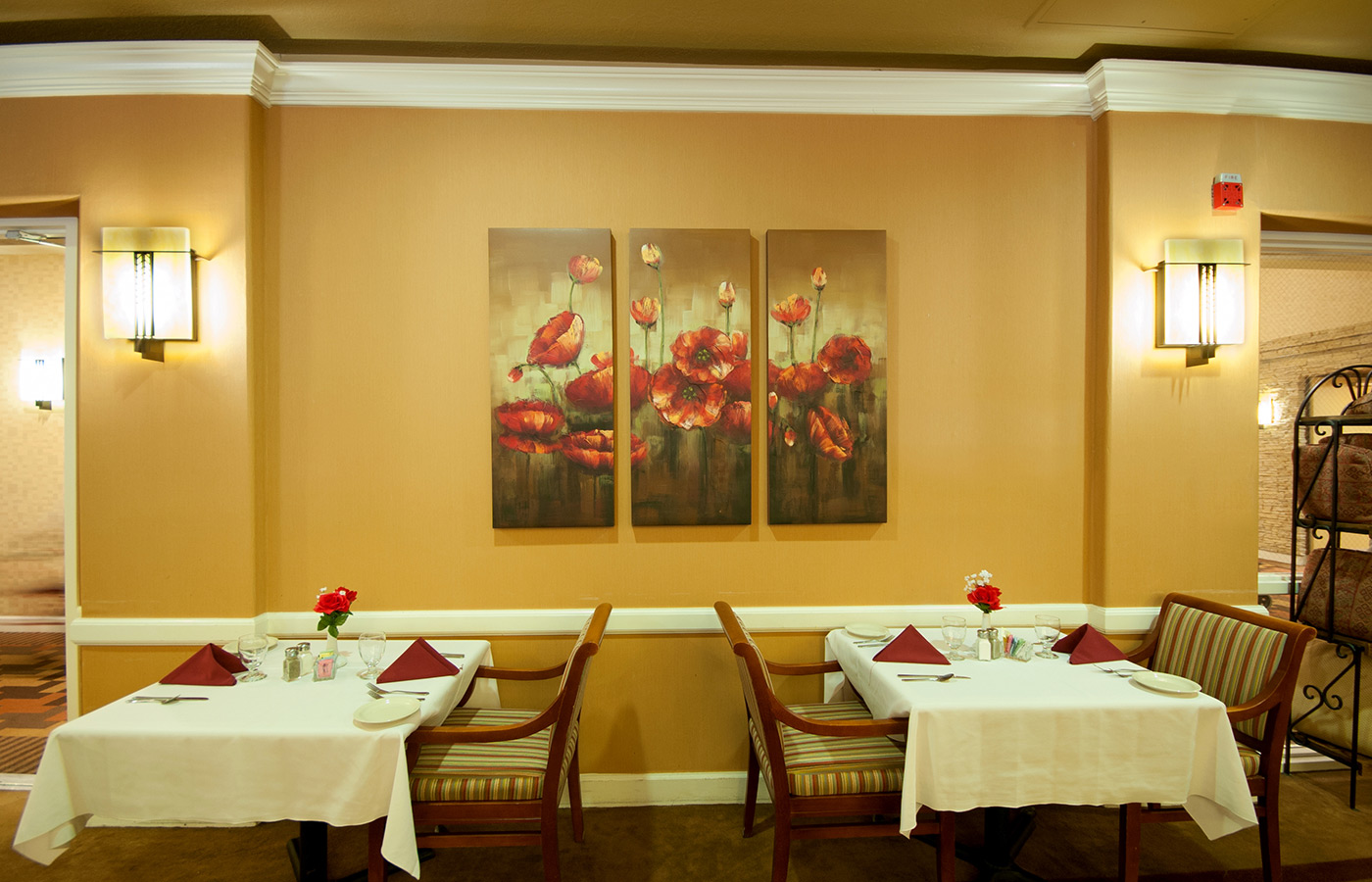 Dining tables set for dinner.