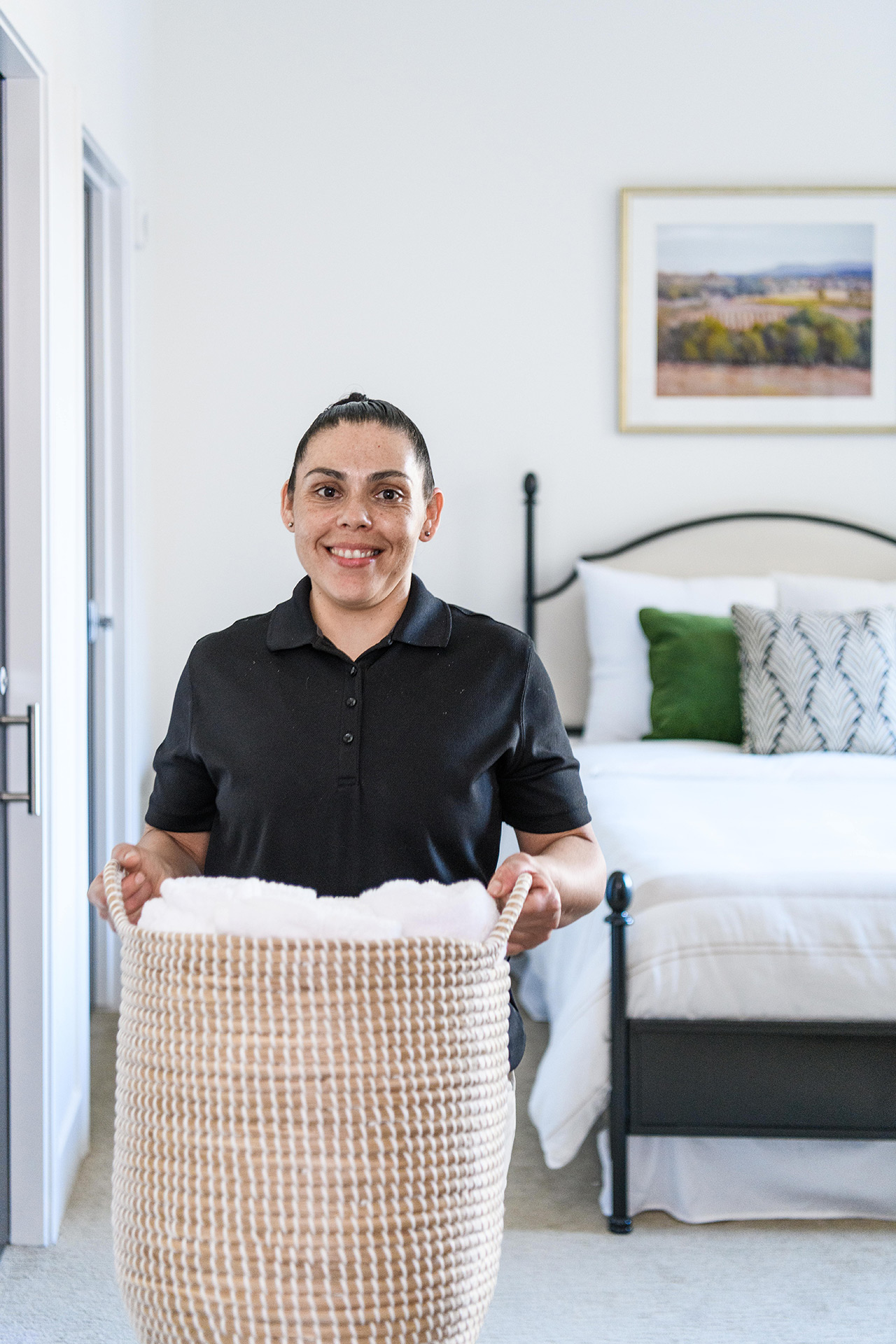 A person is holding a laundry basket.