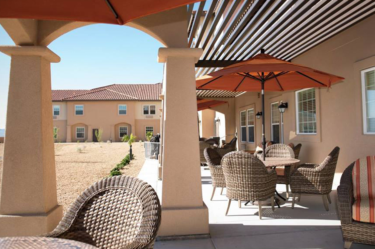 Patio with furniture for sitting.