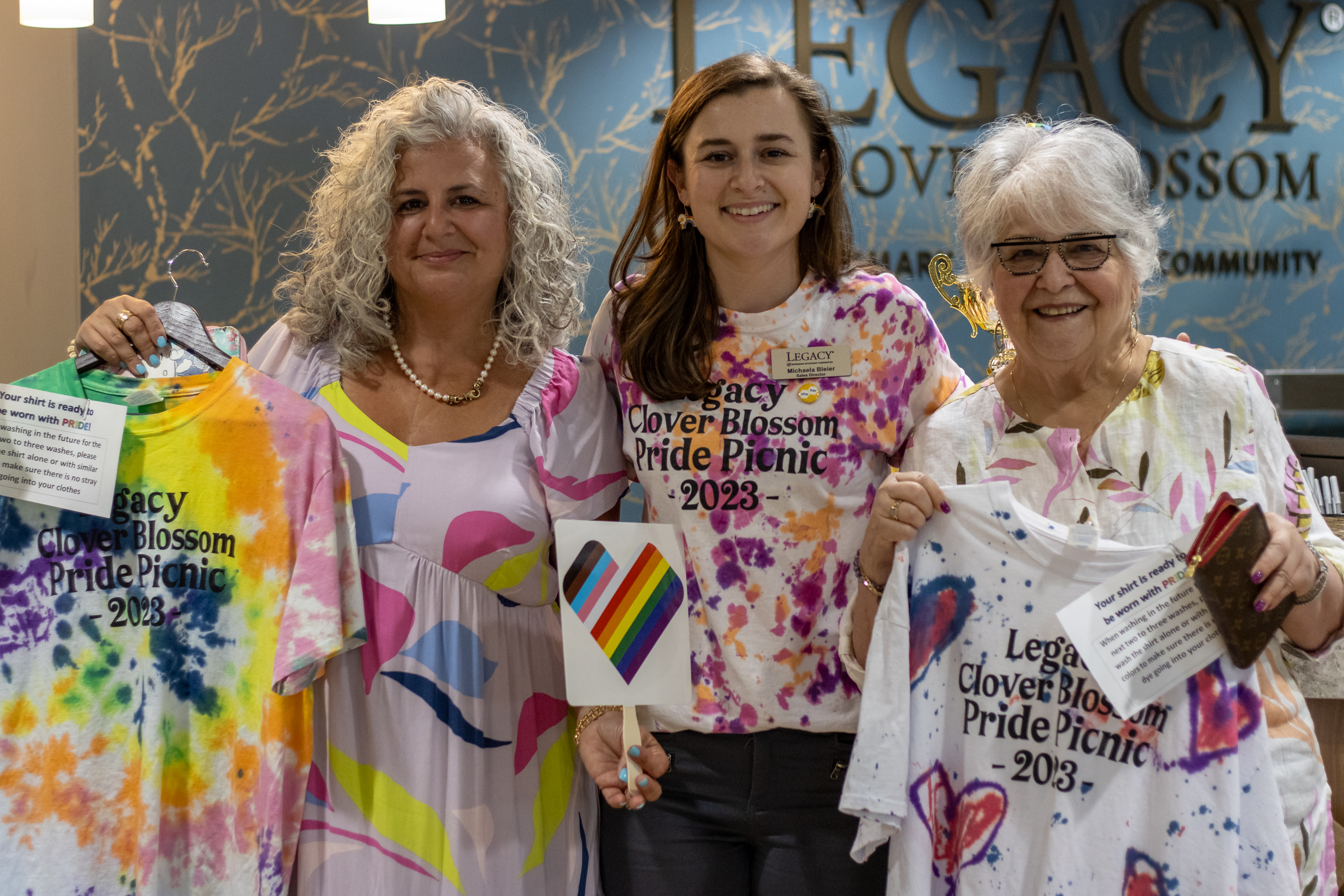 Watermark associate and family members wearing pride shirts.