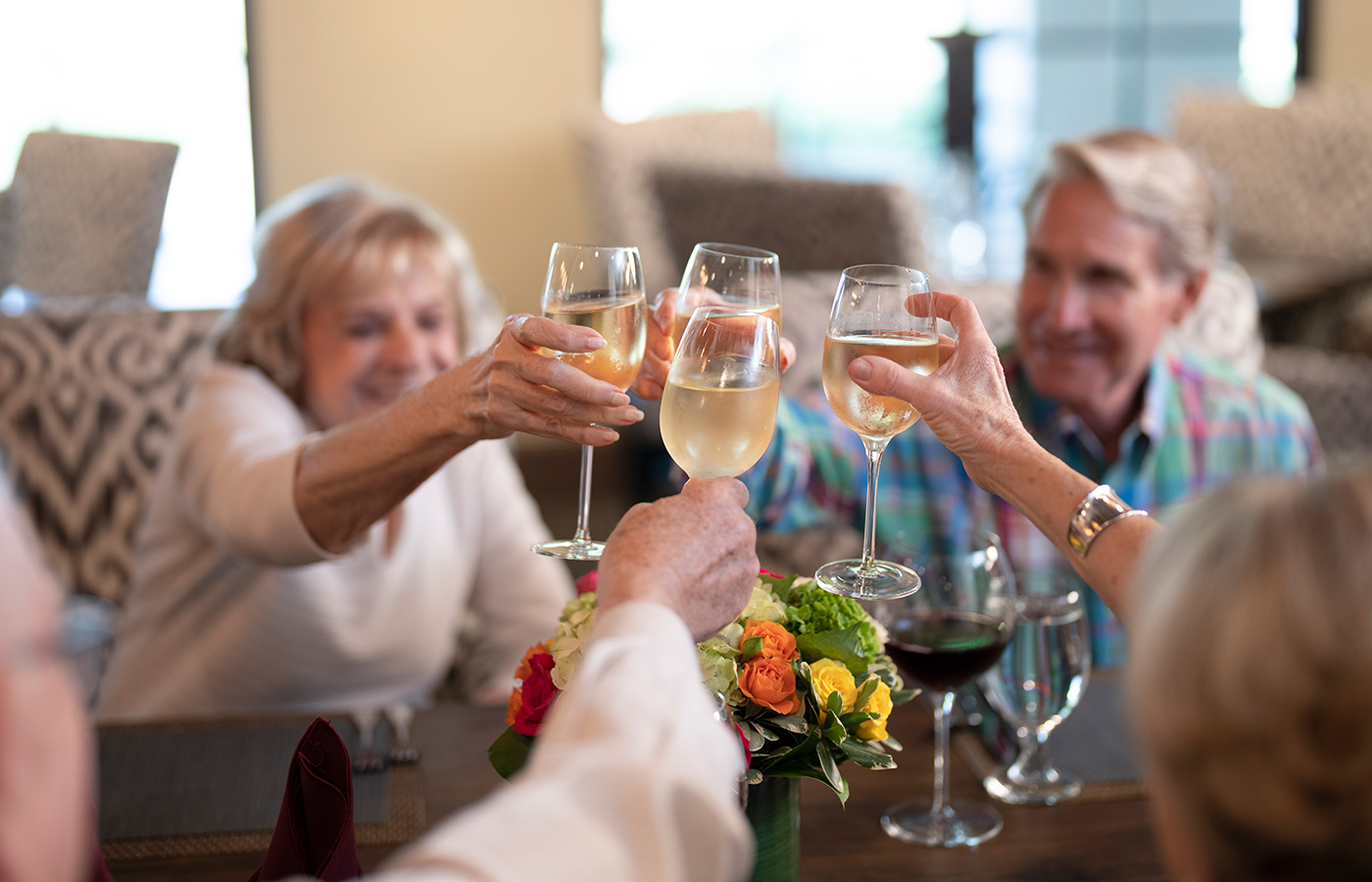 Residents are clinking glasses together.