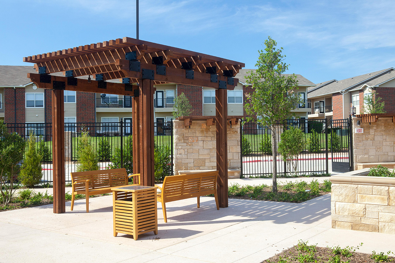 Parkview in Frisco courtyard with bench.