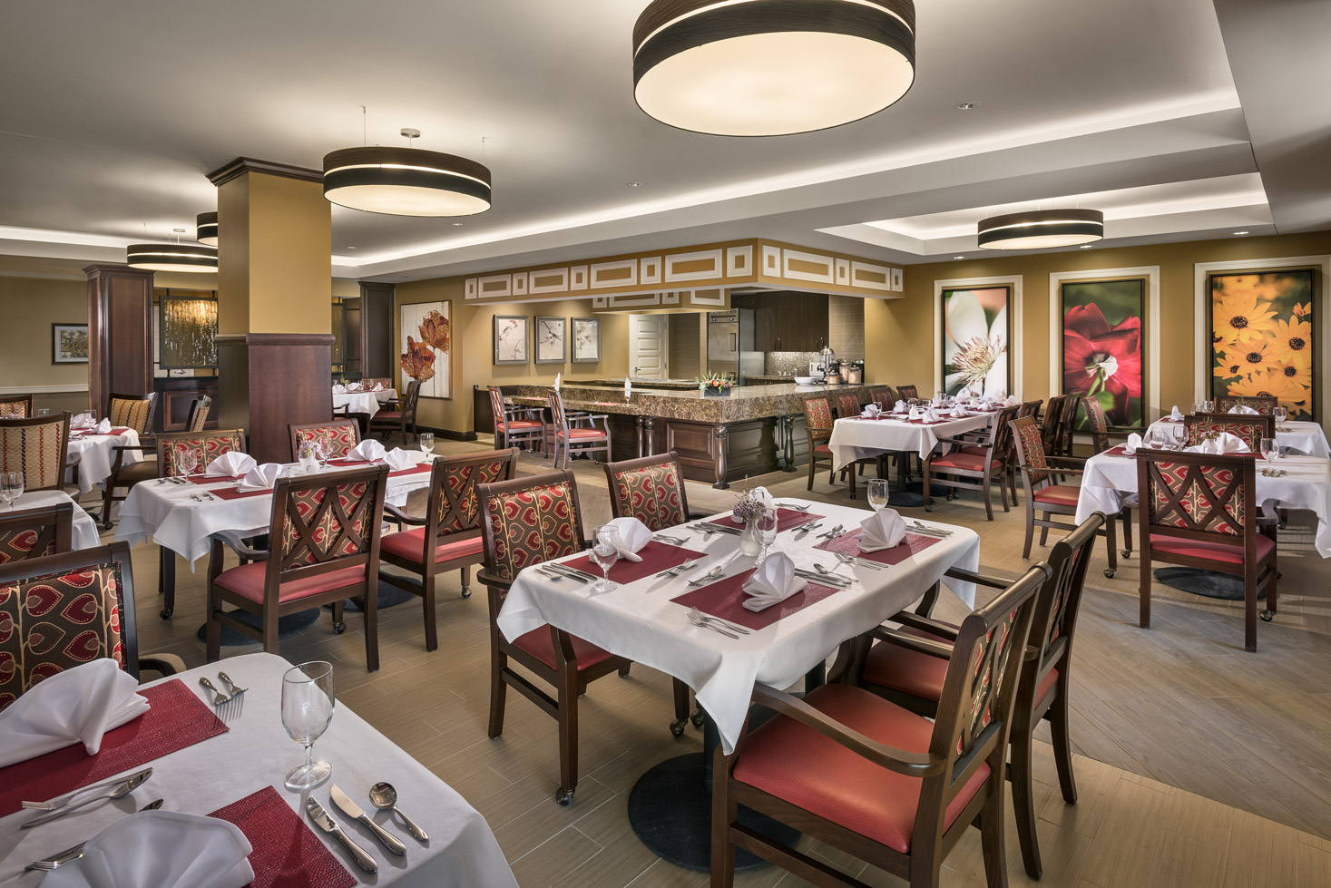 Large dining area with set tables and white tablecloths