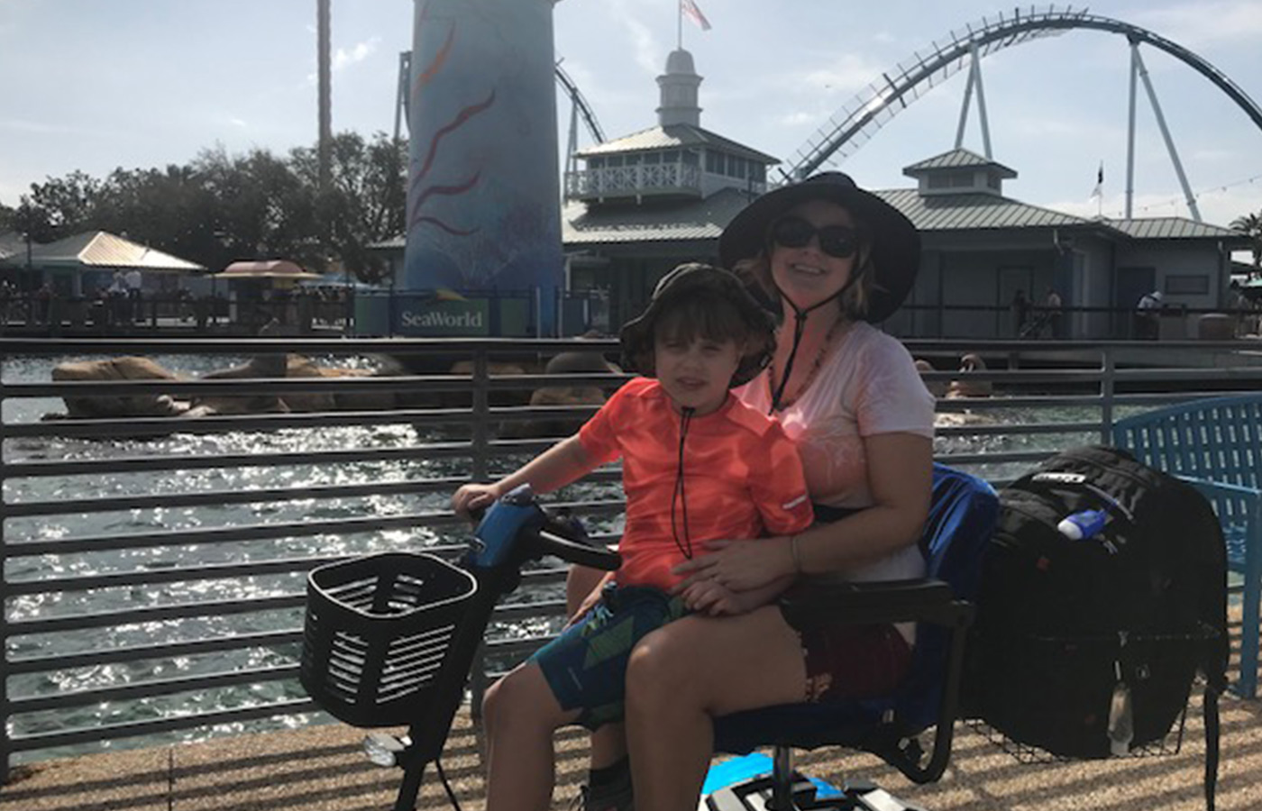 people riding on an electric scooter at SeaWorld