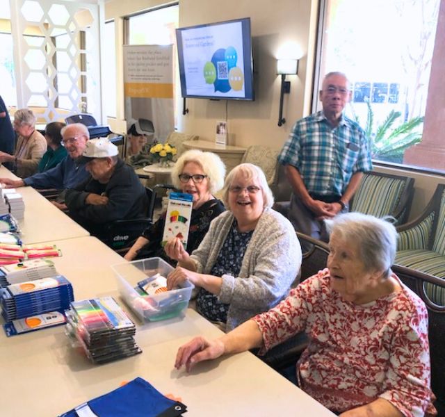 Residents packing up back to school supplies for donating.