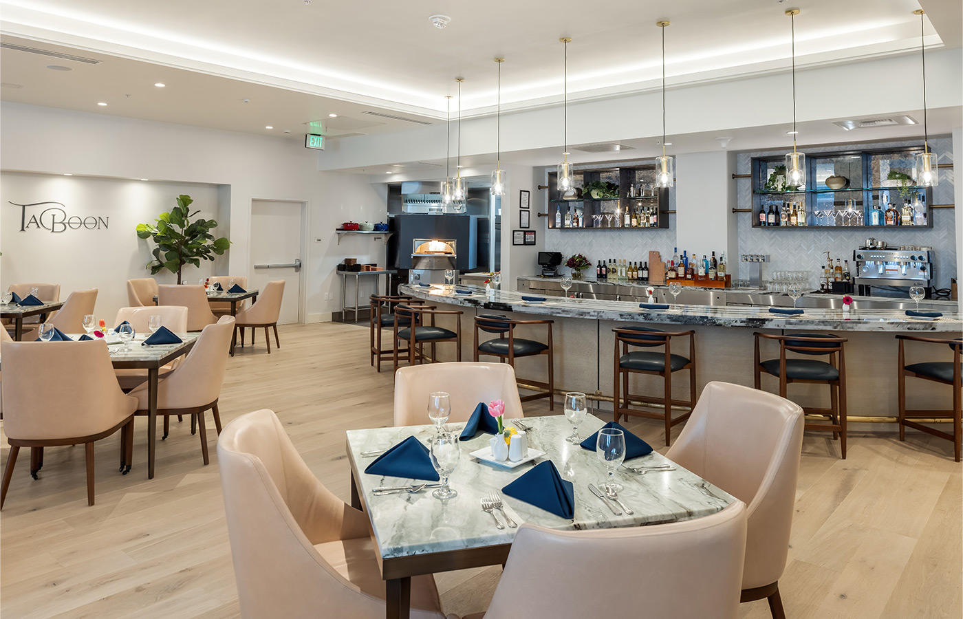 A dining area with tables and counter seating.