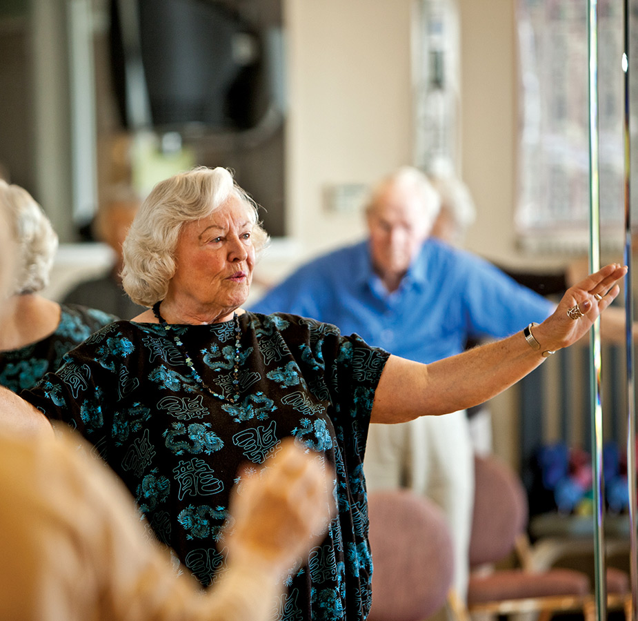 A resident is in a fitness class.