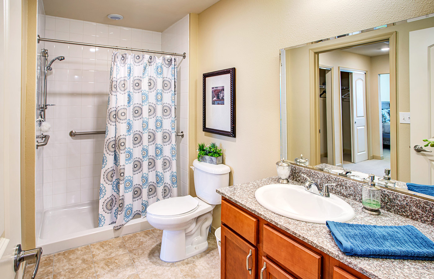 Bathroom with shower, toilet, and sink.
