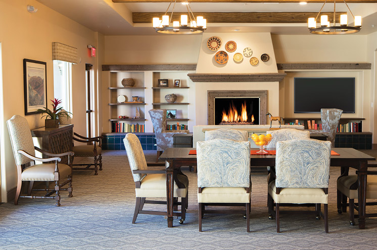 Furnished seating area with a fireplace. 